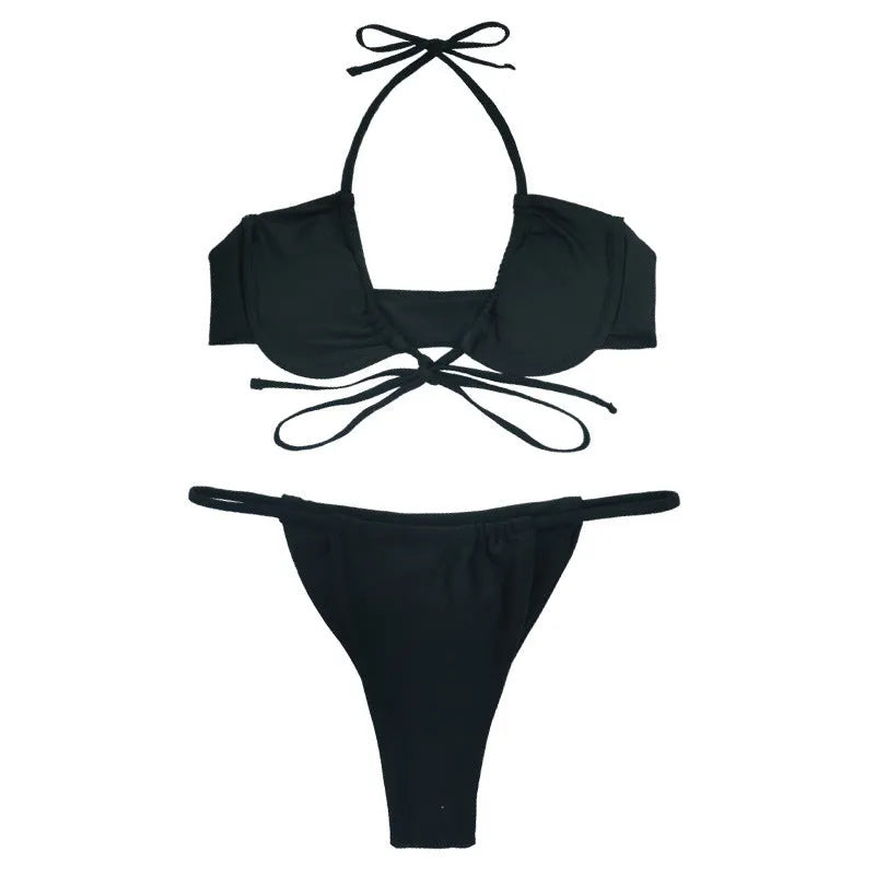 Women's black and mint green nylon fashion split bikini set on a mannequin