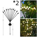 Solar-powered LED firefly garden light with multiple heads and a ground stake.