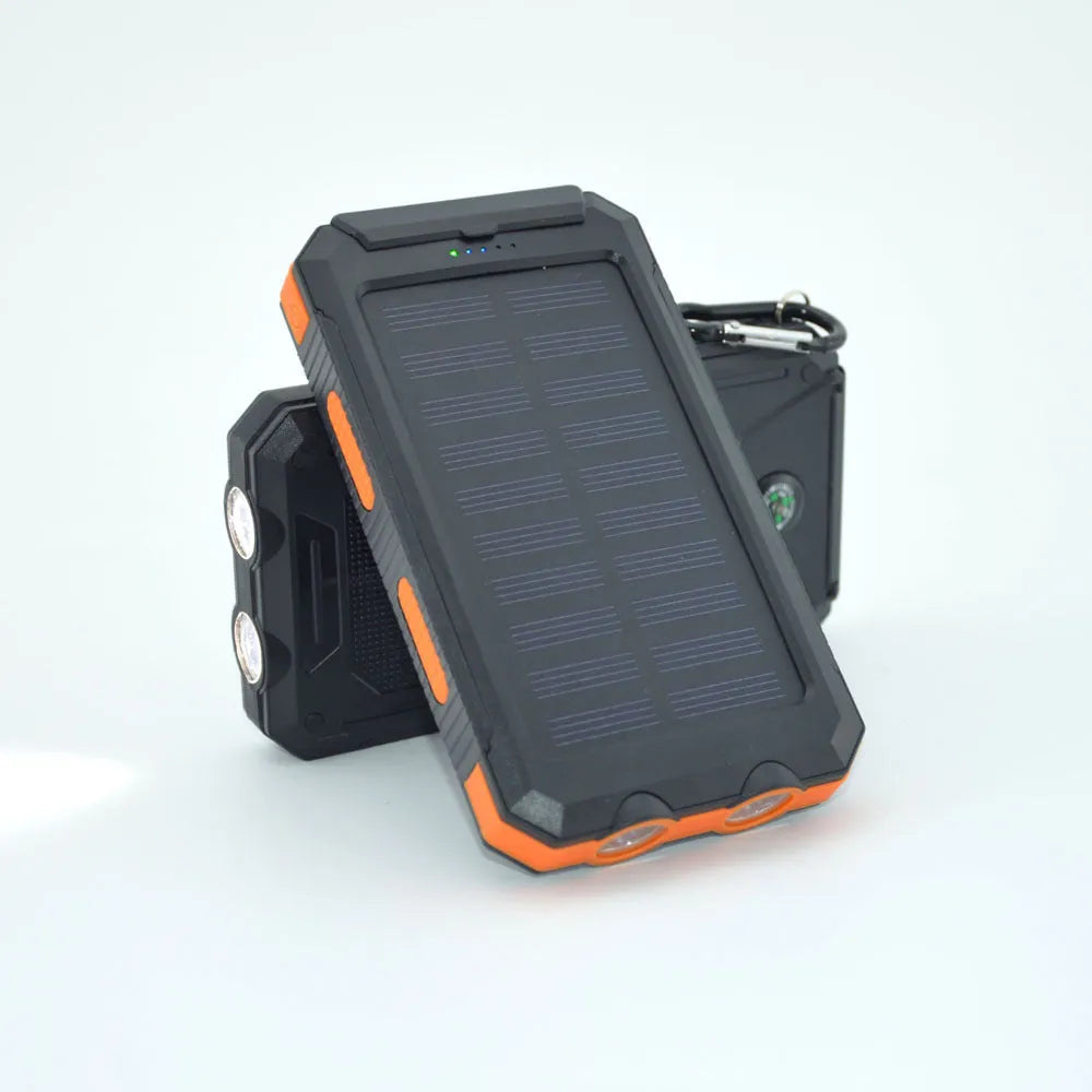 Black solar power bank with 20000mAh capacity showing LED flashlight, compass, and solar panel on casing