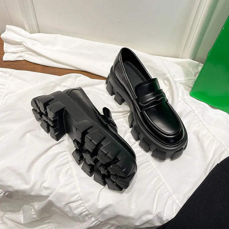 British style wide fit loafers with chunky rubber sole and muffin heel in patent leather.