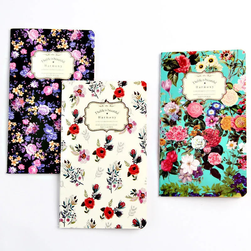 Kraft paper notebook with tassel bookmark showing hand-stitched binding and blank interior pages