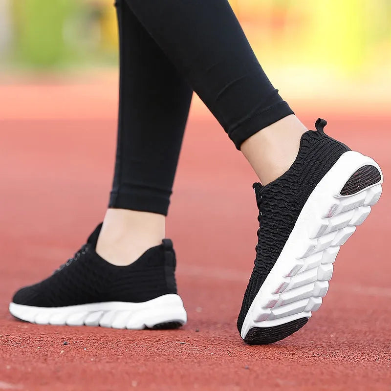 Women's running shoes showing fly weaving upper material and wear-resistant outsole in black, pink, or white colour options
