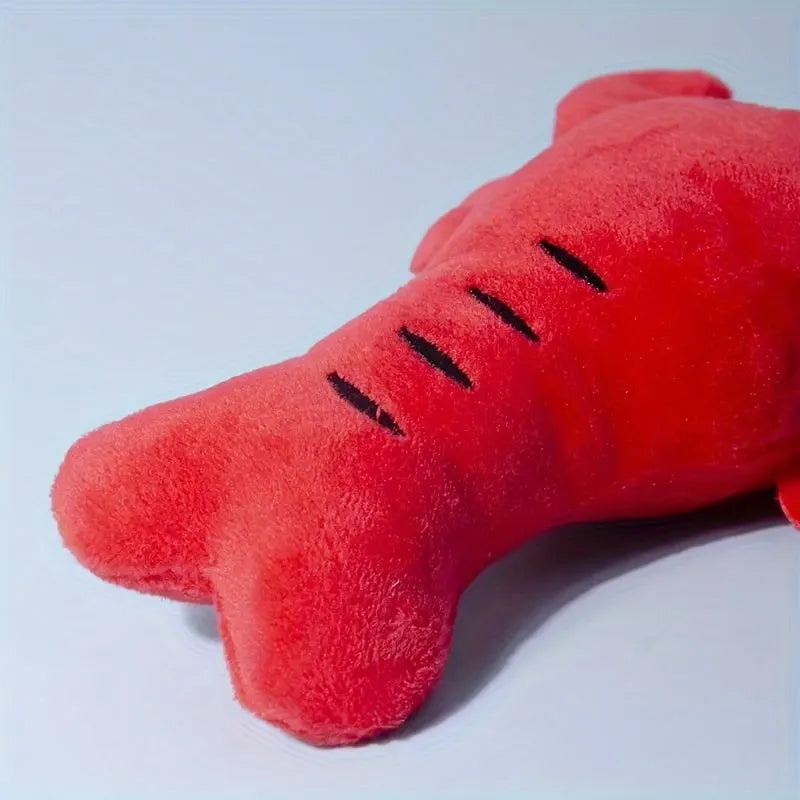 Red lobster-shaped squeaky dog toy with crab-lobster design measuring 12.5cm long