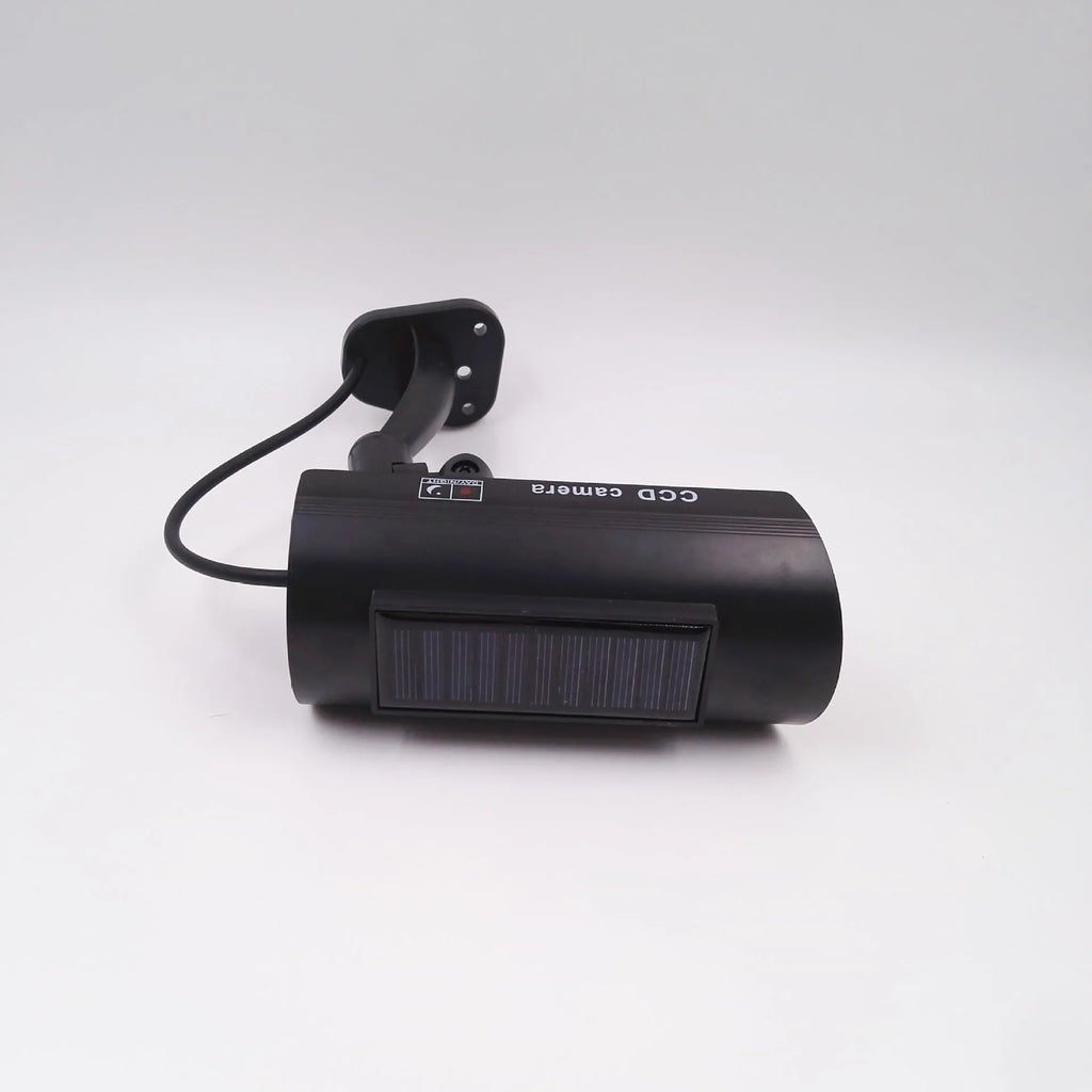 Black gun-style solar simulation security camera for indoor and outdoor deterrent use