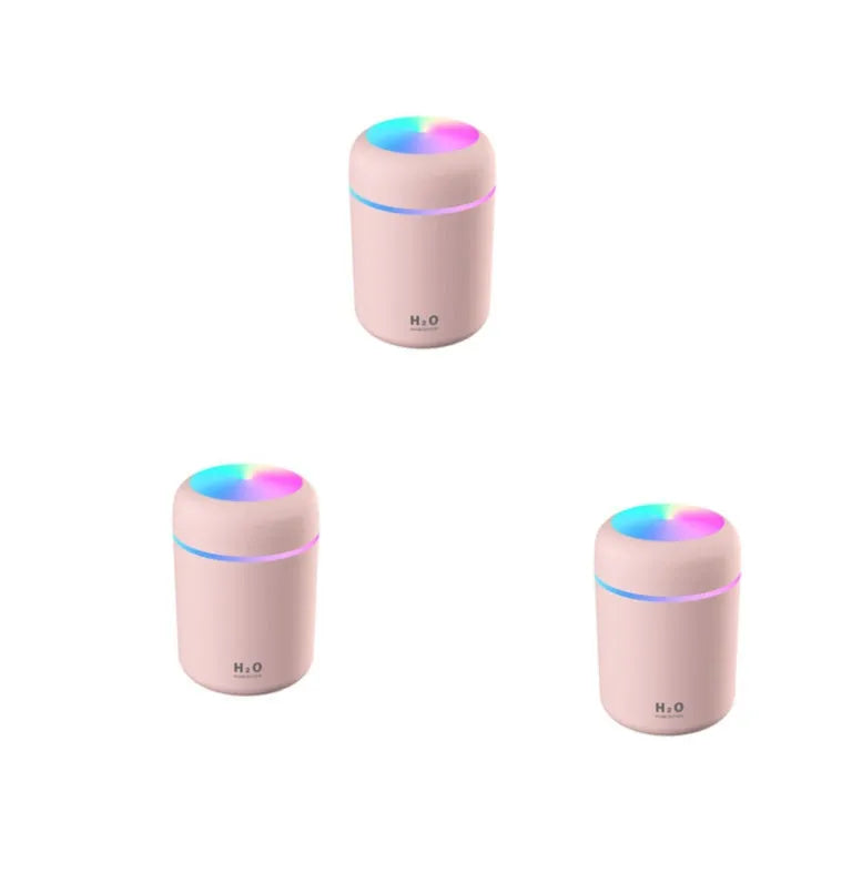 Pink car USB humidifier with LED lights showing water tank and control button