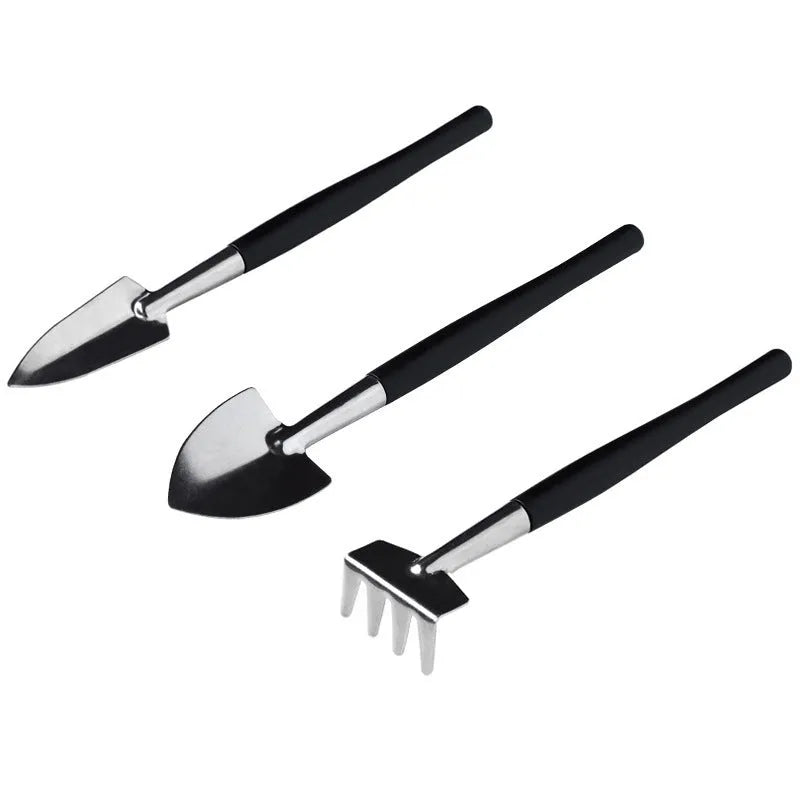 Black plastic and metal mini garden tool set for succulents with 15 pieces including scissors, tweezers, shovels, and a square cushion.
