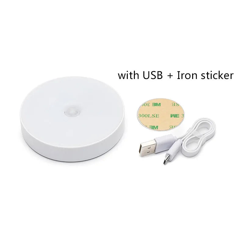 Compact round motion sensor LED night light in beige colour with USB charging cable