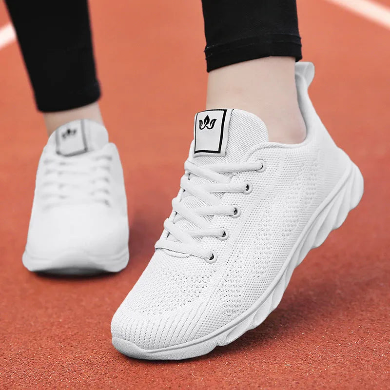 Women's white high-top casual trainers with back lacing and cross strap detail