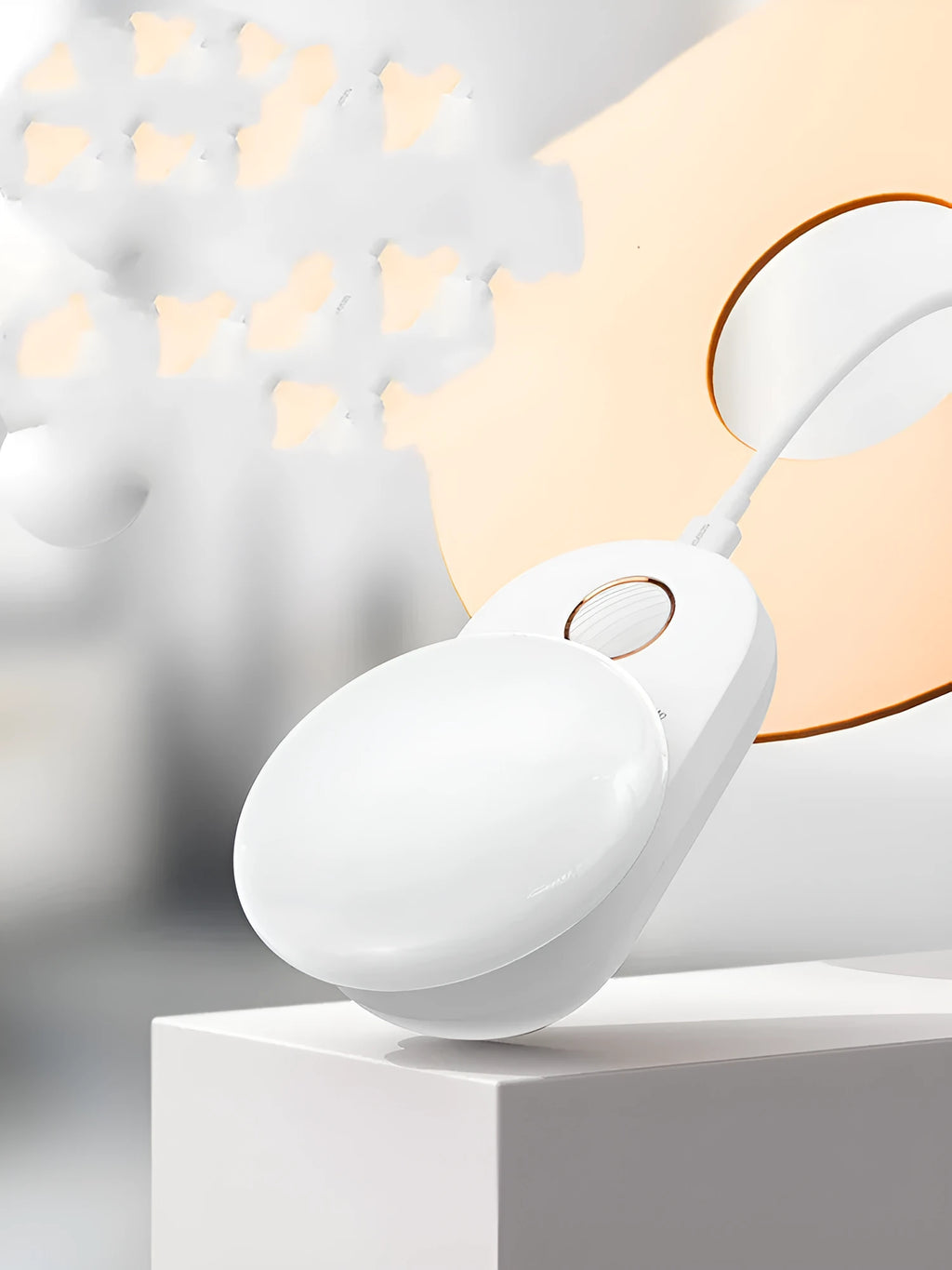 White Baseus rechargeable sensor night light with motion detection on a bedside table.
