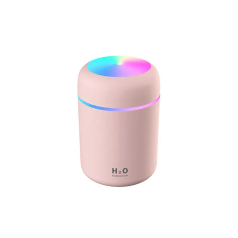Pink car USB humidifier with LED lights showing water tank and control button