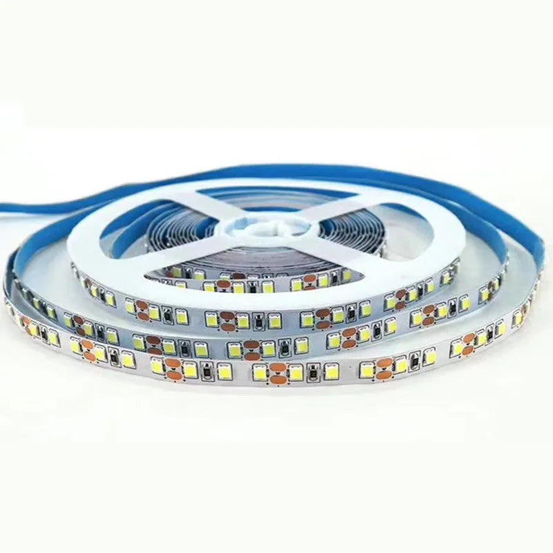 2835 and 5050 white LED strip light on a reel, showing close-up of rectangular patch-style LEDs.