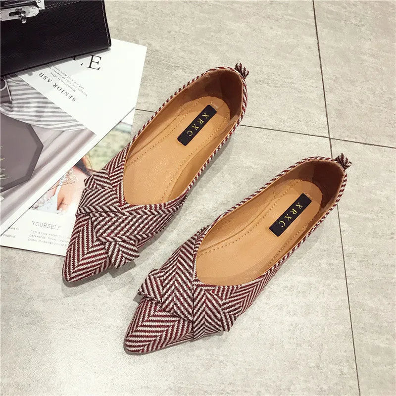 Women's pointed toe shallow mouth shoes in red and black with low flat heel