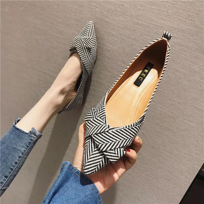Women's pointed toe shallow mouth shoes in red and black with low flat heel