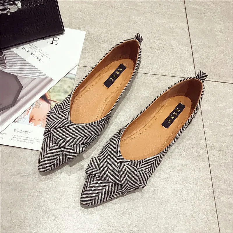 Women's pointed toe shallow mouth shoes in red and black with low flat heel