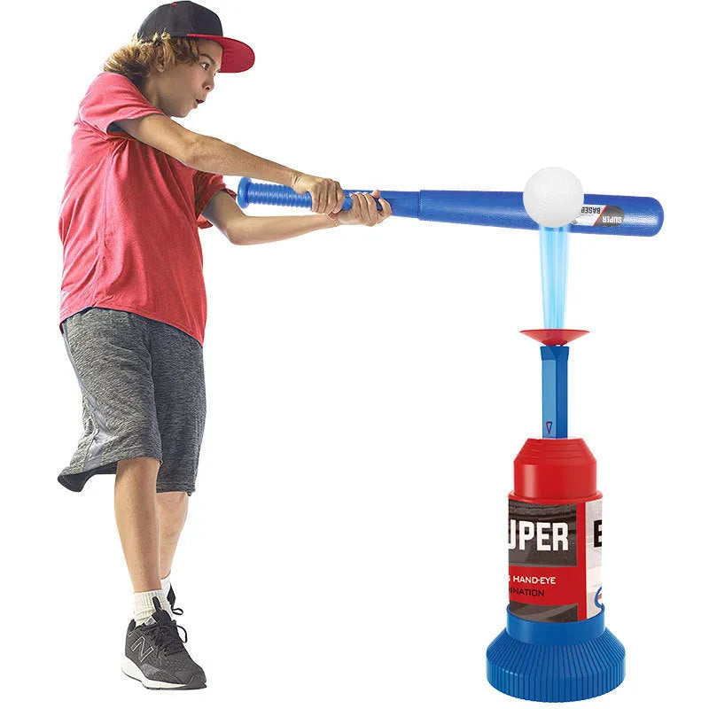 Children's baseball serving trainer toy with step pedal, collapsible bat, and three baseballs on grass