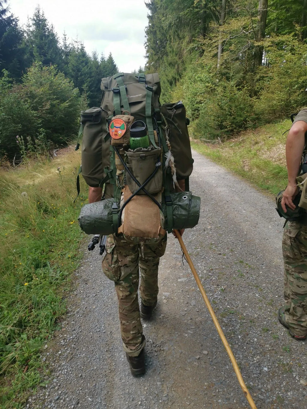 Tactical backpack in black, polyester mountaineering bag 36-55L capacity with military pattern