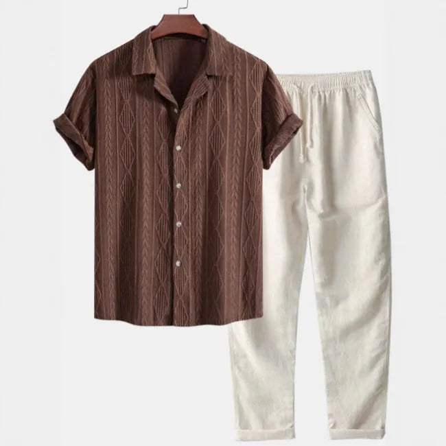 Man wearing a slim fit camouflage print short-sleeve shirt and matching trousers casual suit set.