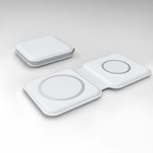 White folding dual magnetic wireless charging dock shown in stand mode with a phone attached.