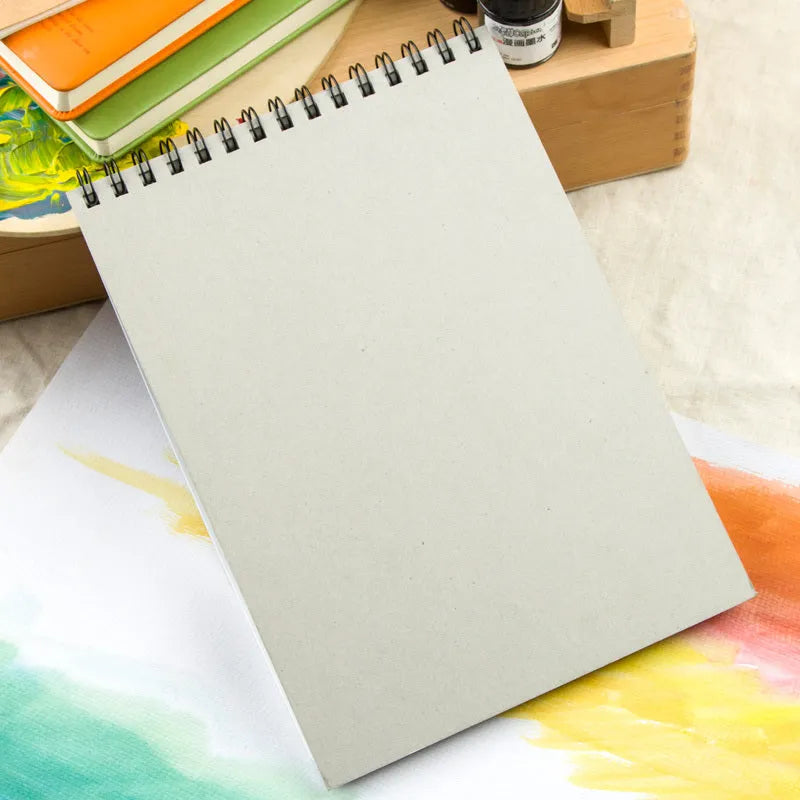 Spiral-bound water-soluble coloured lead sketchbook pad in 8K or 16K size with green paper.