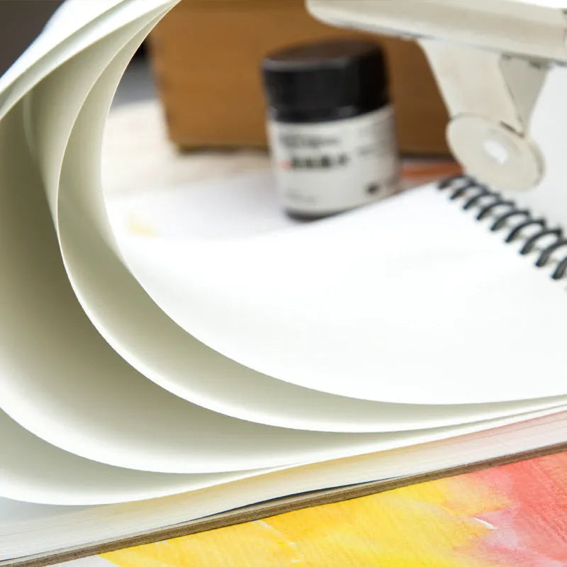 Spiral-bound water-soluble coloured lead sketchbook pad in 8K or 16K size with green paper.