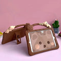 Brown cartoon-style silicone sleeve for iPad with an integrated flip-out bracket stand.
