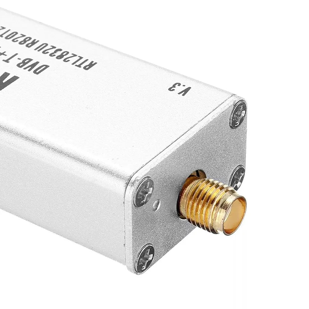 Black all-band software-defined radio receiver with golden SMA connector for computer-based signal reception.