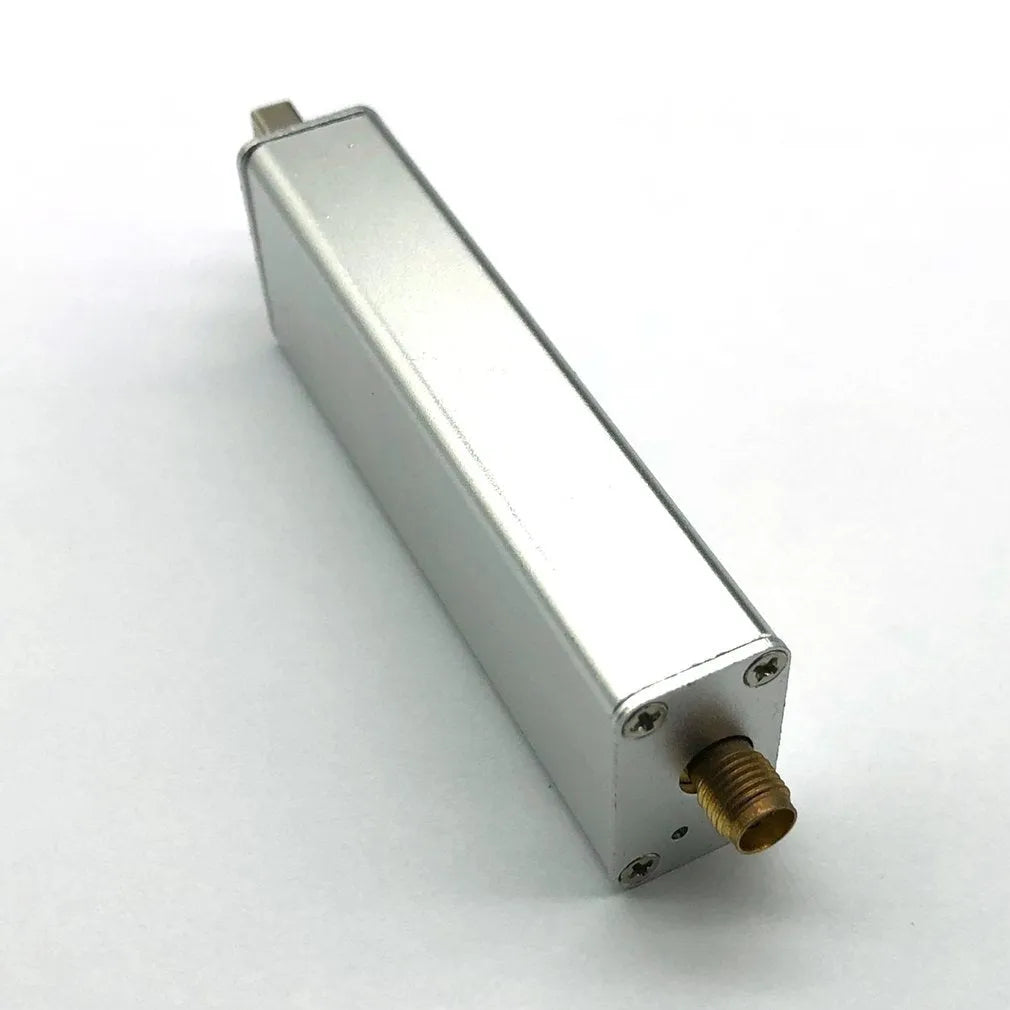 Black all-band software-defined radio receiver with golden SMA connector for computer-based signal reception.