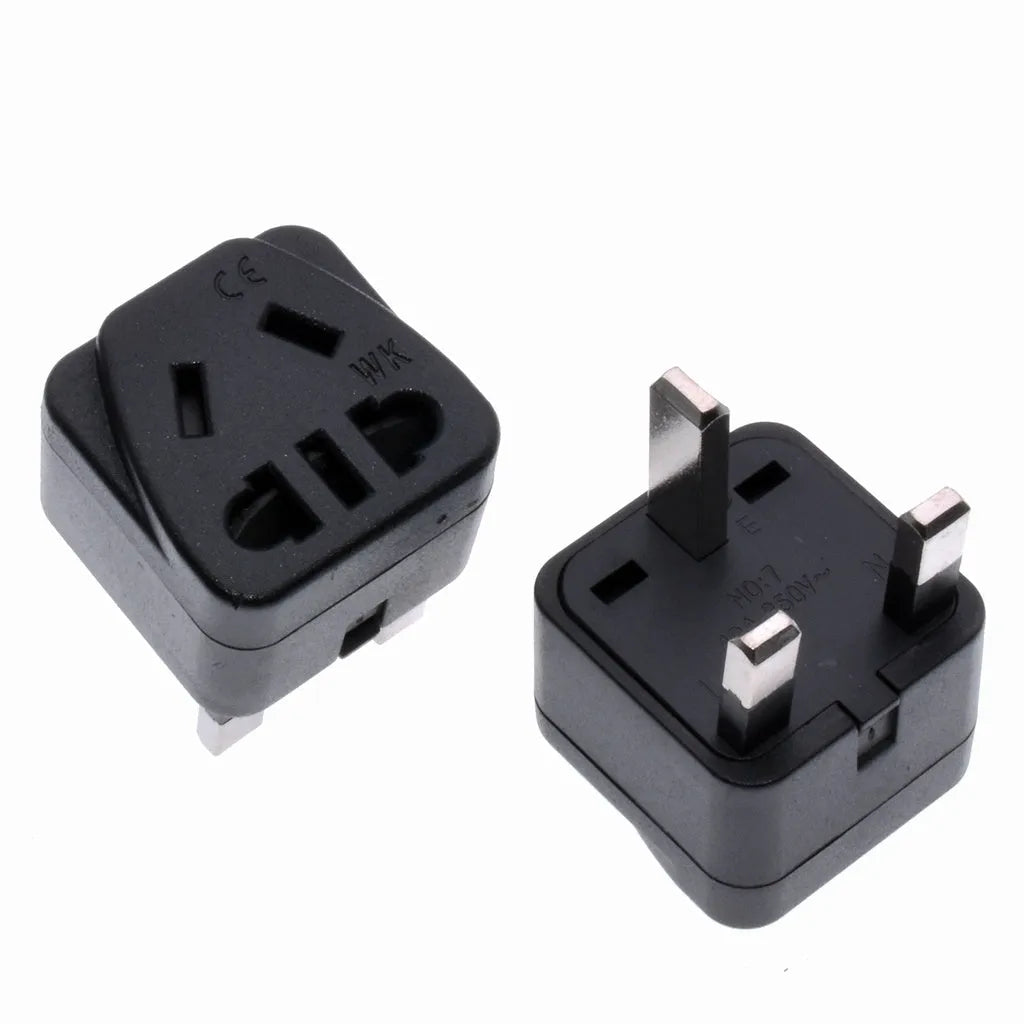 Square white international plug adapter with five outlets and a UK three-pin plug.