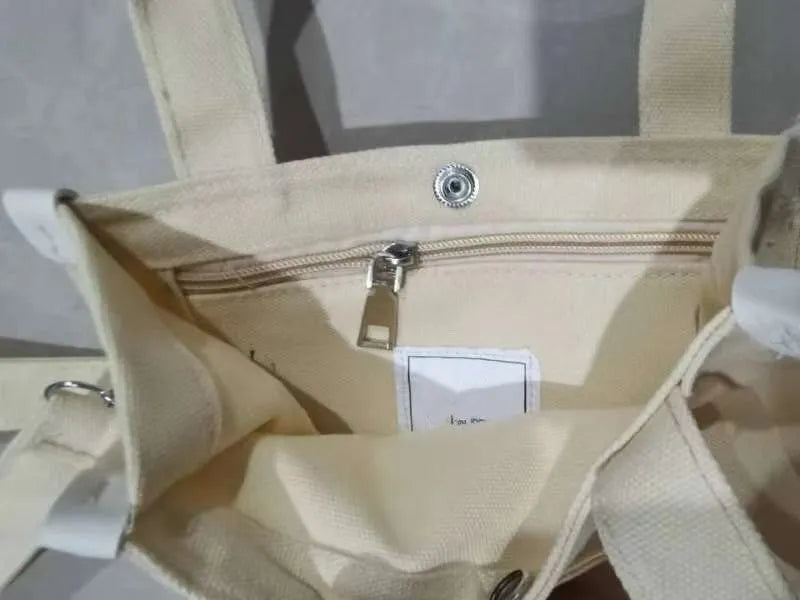 Canvas small square messenger bag for women with magnetic buckle closure in khaki colour