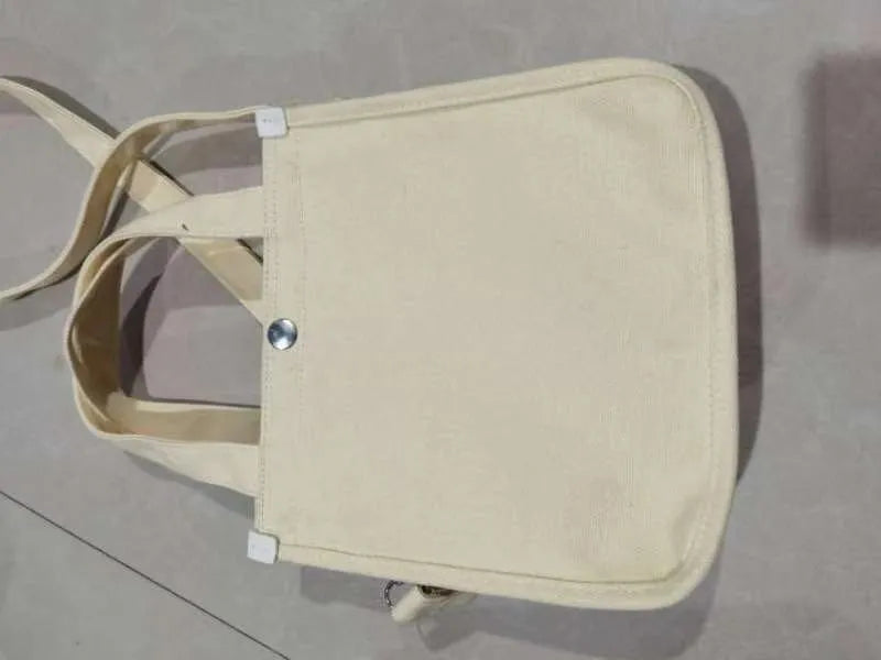 Canvas small square messenger bag for women with magnetic buckle closure in khaki colour