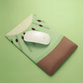 A kiwi-themed mouse pad with a built-in soft wrist support, featuring a cute creative girl design on a cloth surface.