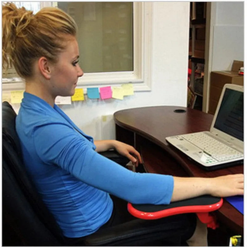 Black rotating computer hand bracket wrist pad showing 180-degree adjustment on desk