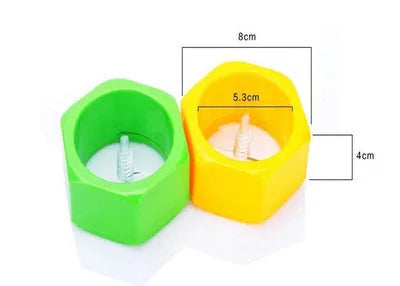 Yellow and green plastic spiral vegetable cutter for cucumbers on a kitchen counter.