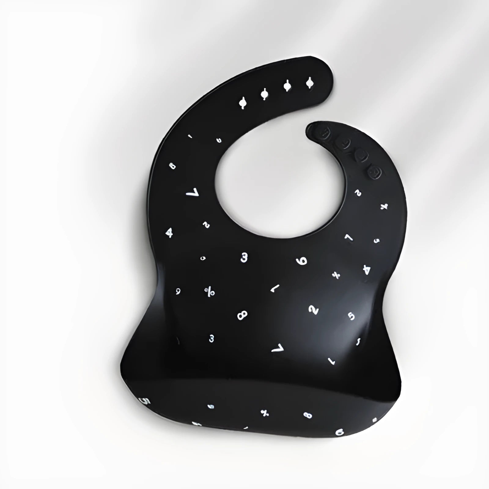Pink baby waterproof silicone feeding bib with deep pocket and white daisy pattern