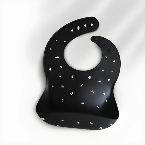 Pink baby waterproof silicone feeding bib with deep pocket and white daisy pattern