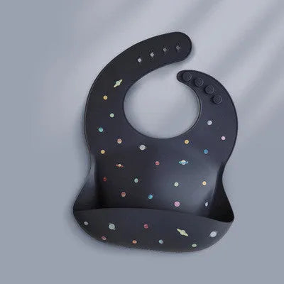 Pink baby waterproof silicone feeding bib with deep pocket and white daisy pattern