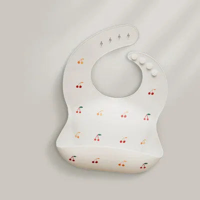 Pink baby waterproof silicone feeding bib with deep pocket and white daisy pattern