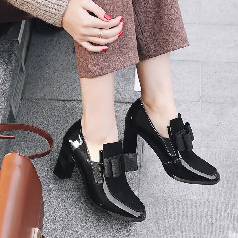 Large size black patent leather women's high heels with a thick super high heel and square toe.