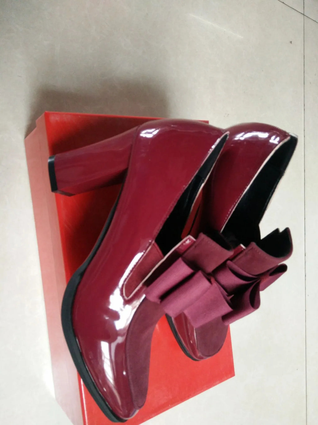 Large size black patent leather women's high heels with a thick super high heel and square toe.