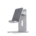 Alloy lazy bracket mobile phone holder in dark grey, clamped to a desk edge holding a smartphone.