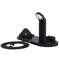 Black three-in-one wireless charging bracket holding iPhone, Apple Watch, and headphones