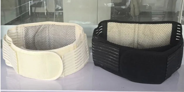 Black self-heating magnetic therapy waist support belt wrapped around a model's lower back.
