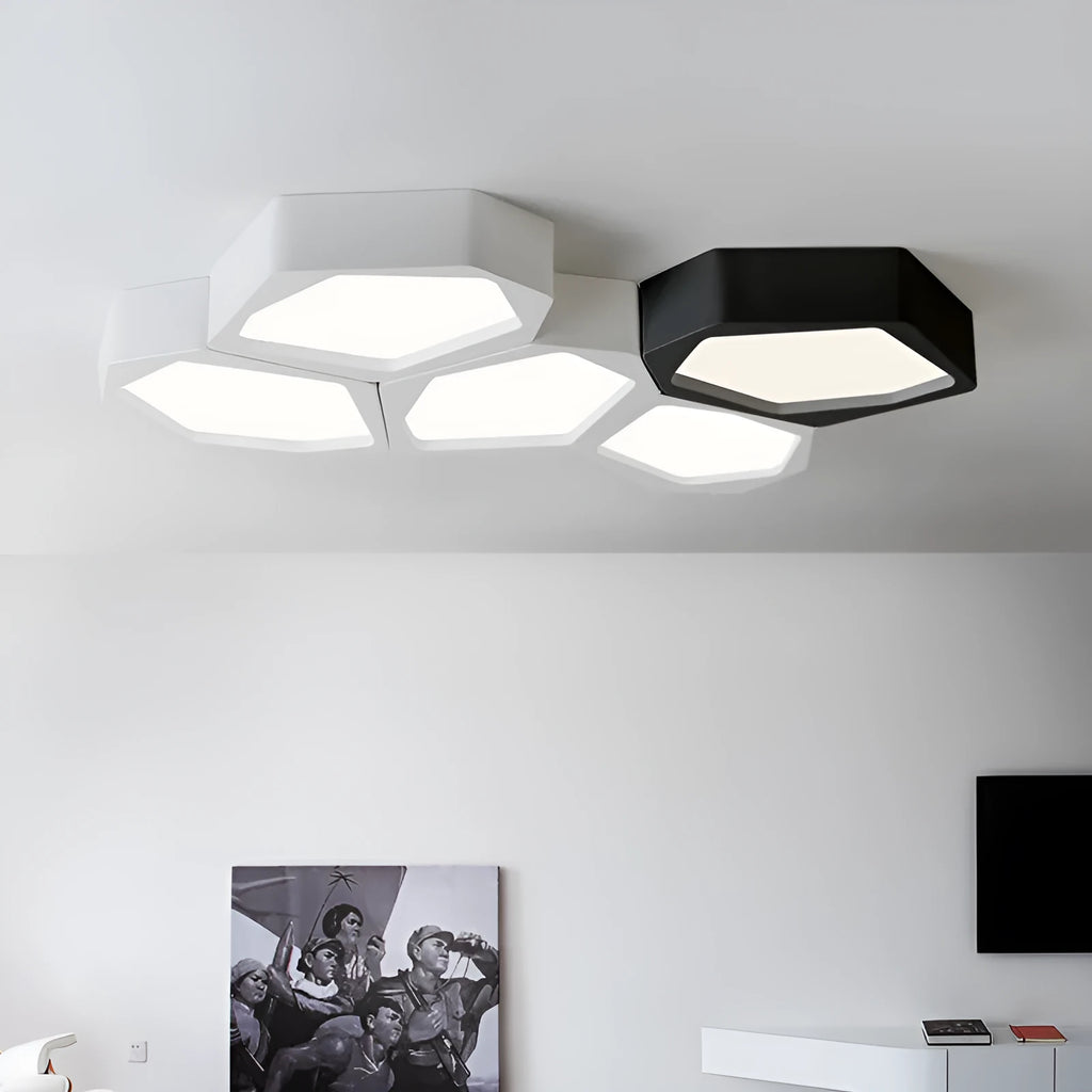 Geometric shaped black and white iron LED ceiling light with remote control on a table