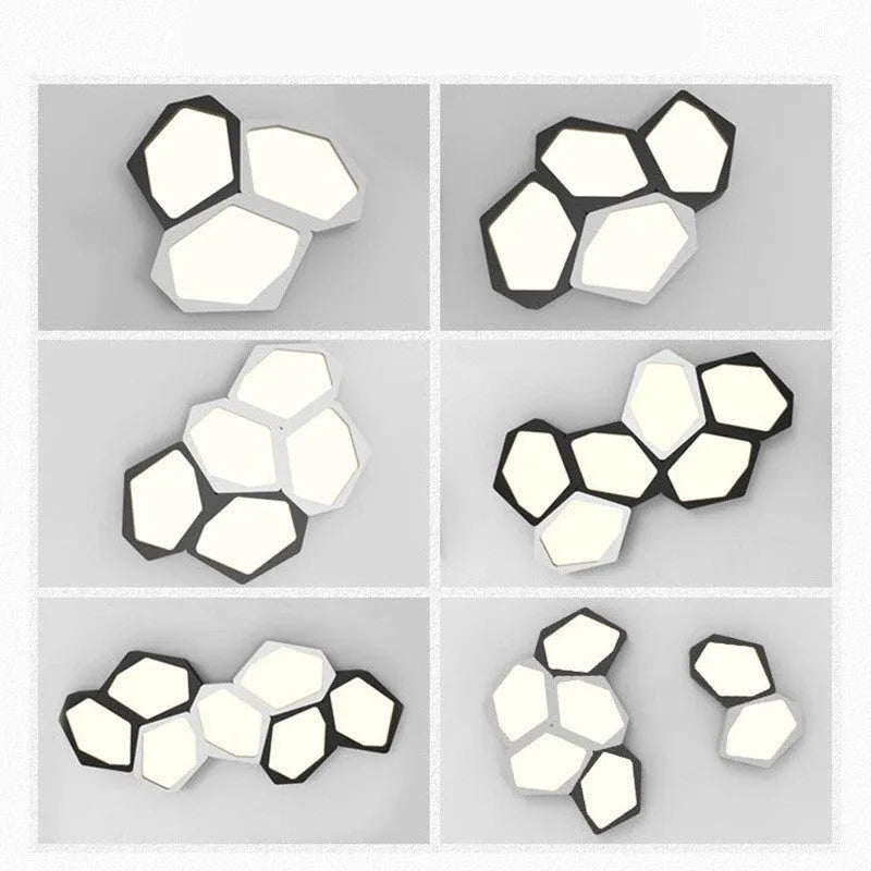 Geometric shaped black and white iron LED ceiling light with remote control on a table