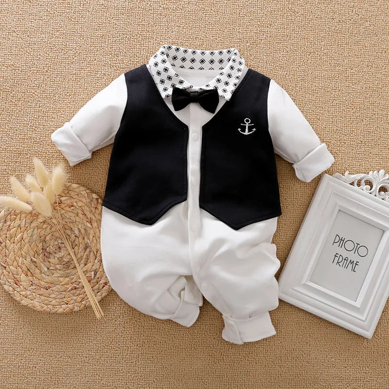 Baby boy wearing a cotton jumpsuit in gentleman style with long sleeves
