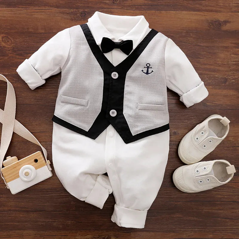 Baby boy wearing a cotton jumpsuit in gentleman style with long sleeves