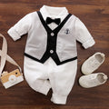 Baby boy wearing a cotton jumpsuit in gentleman style with long sleeves