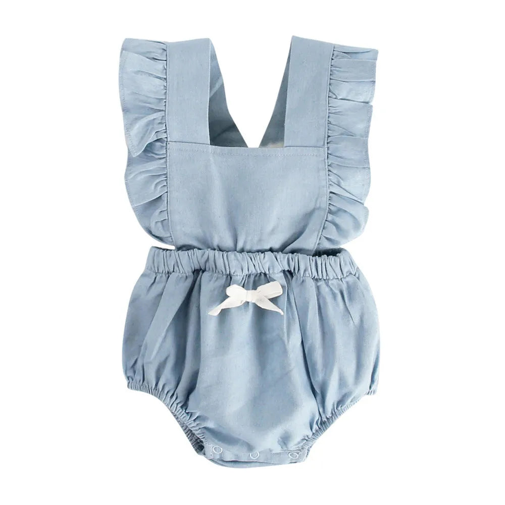 Blue denim sleeveless baby romper with lace detail and triangle neckline on a hanger.