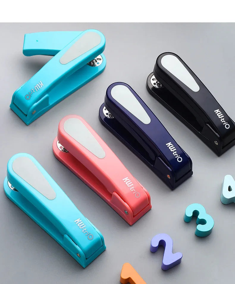 A rotatable student stapler with a 360° spinning head, shown in blue on a desk with papers.