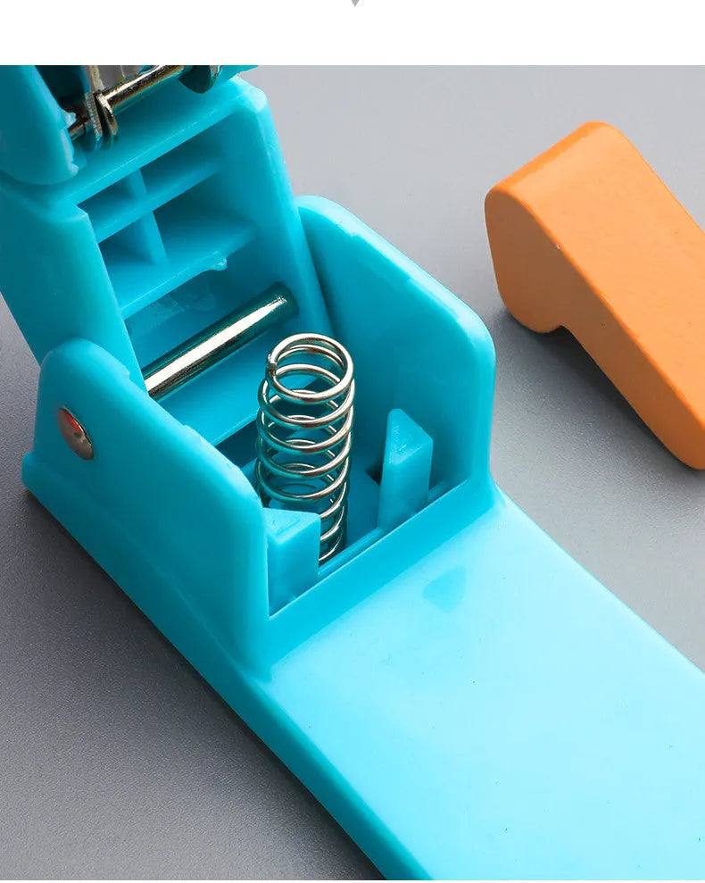 A rotatable student stapler with a 360° spinning head, shown in blue on a desk with papers.